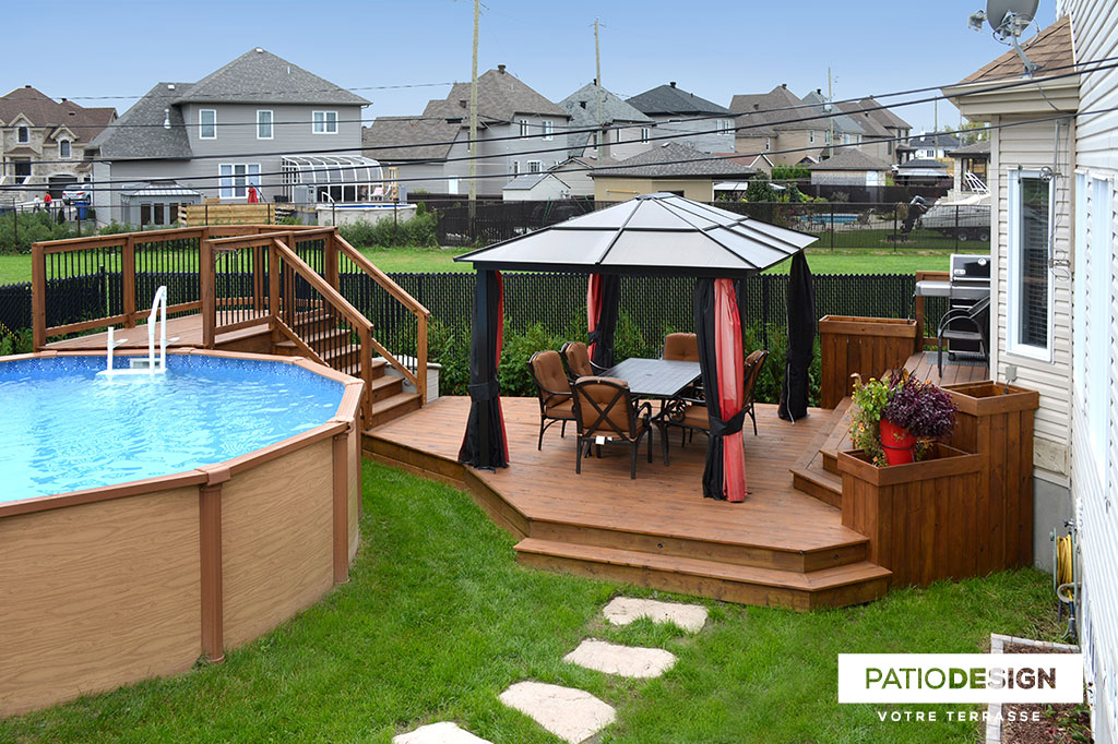 Patio around above ground pool by Patio Design inc.