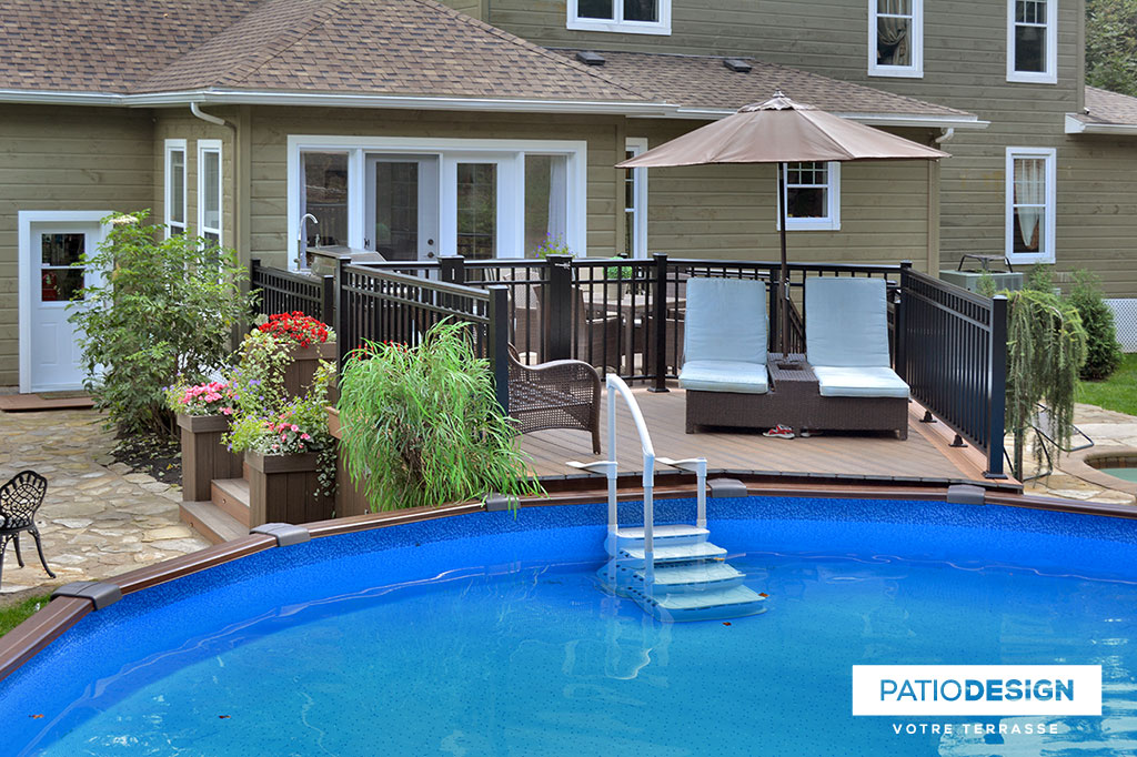 Patio around above ground pool by Patio Design inc.
