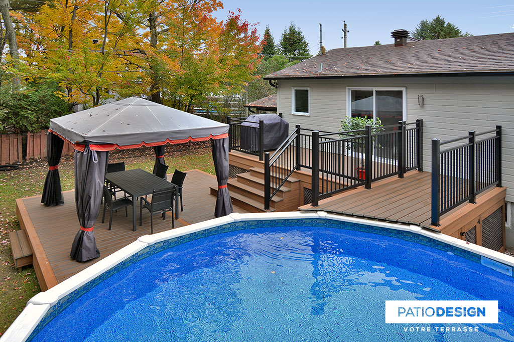 Patio around above ground pool by Patio Design inc.