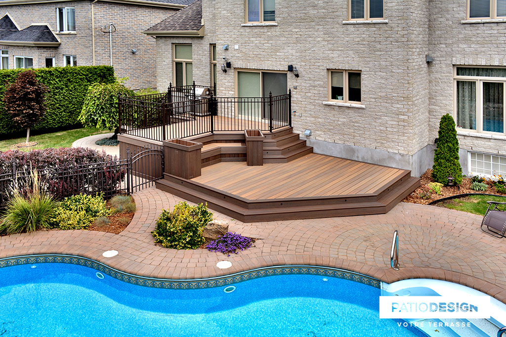 Patio around an inground pool by Patio Design inc.