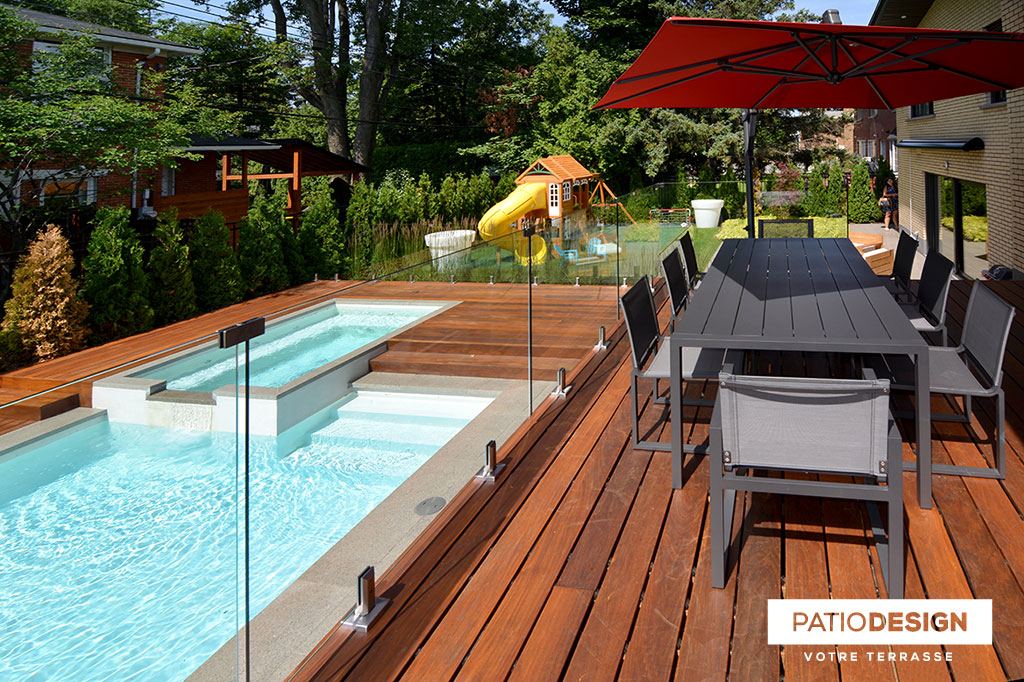 Patio around an inground pool by Patio Design inc.