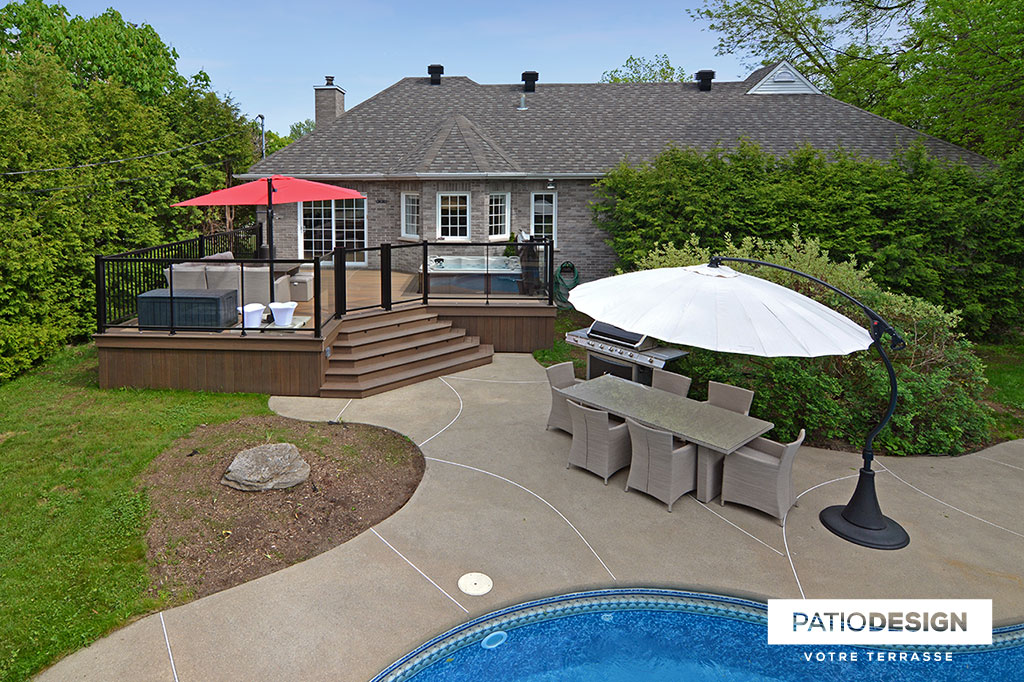 Patio around an inground pool by Patio Design inc.