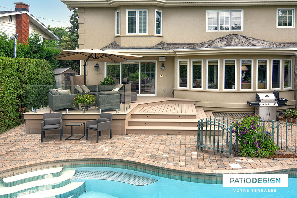 Patio around an inground pool by Patio Design inc.