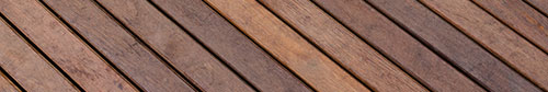 Plancher bois traité et teint brun terra par Patio Design